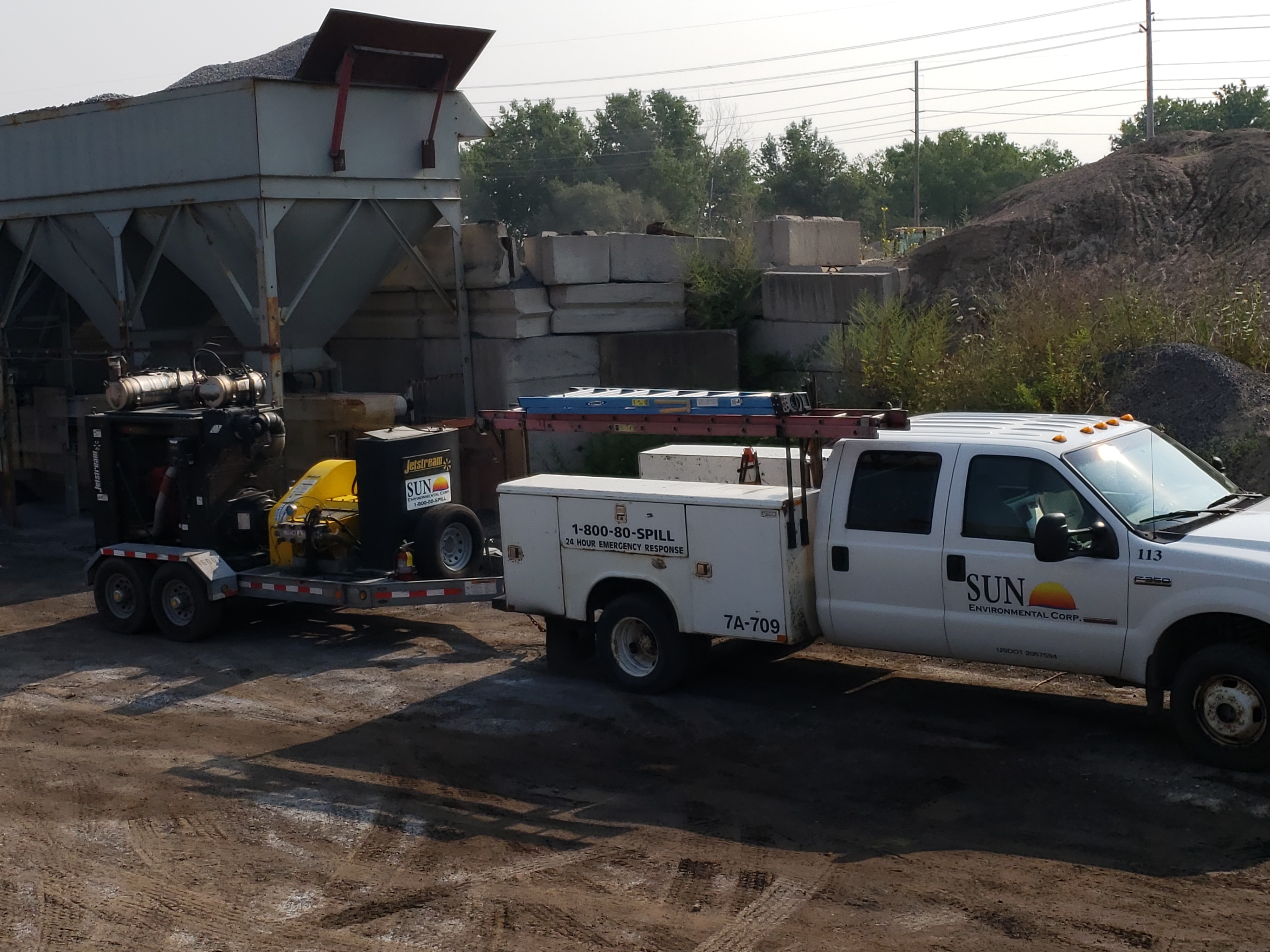 Sun Environmental Corp. crew member using hydroblaster Sun Environmental Corp. crew member using hydroblaster