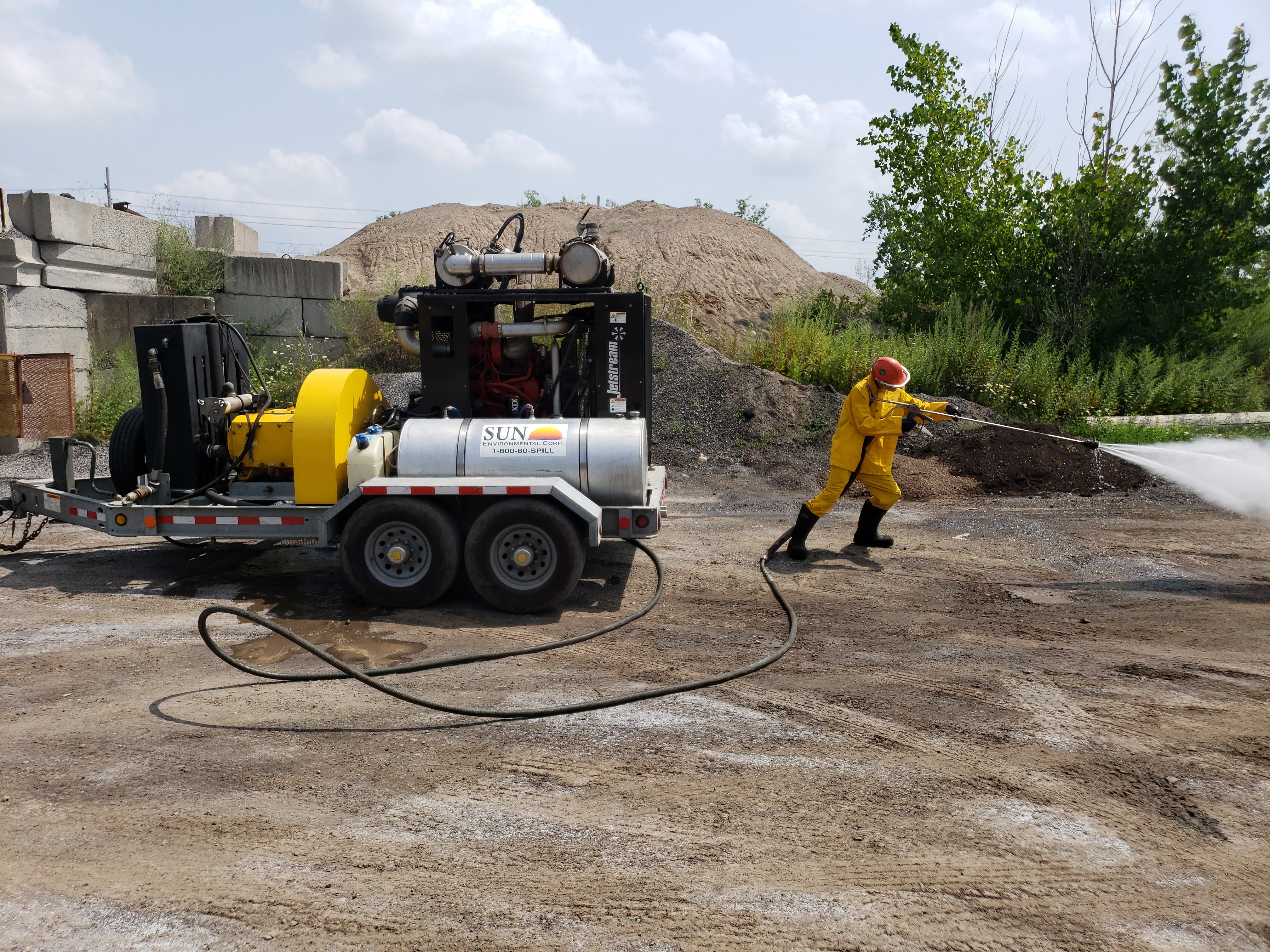 Sun Environmental Corp. water blaster team at work Sun Environmental Corp. water blaster team at work